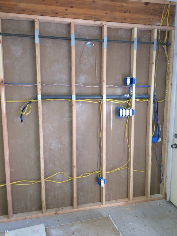 The view from the shop. Justin put that pipe in to pull all the wires from the wall to the someday TV… look Ma, no hanging wires!